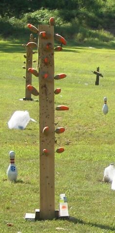 an outdoor climbing wall in the middle of a field