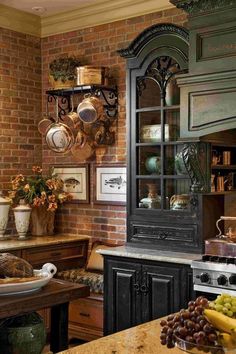 a kitchen with an oven, counter top and shelves filled with pots and pans