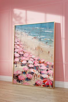 a painting on the wall of a beach with pink walls and people under umbrellas