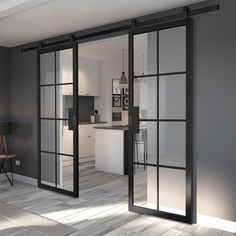 an open living room and kitchen area with sliding glass doors