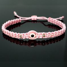 Hand-Made Pink String Bracelet With An Evil Eye For Wrist Sizes From 6 To 9 In. These Bracelets Are Worn To Attract Good Fortune, Bring A Good Mood And To Ward Off Bad Vibes. Evil Eye Bracelet Braided, Pink Adjustable Bracelet Jewelry, Adjustable Pink Evil Eye Bracelet, Pink Resizable Braided Bracelet, Elegant Adjustable Pink Friendship Bracelets, Elegant Pink Braided Bracelets As Gift, Elegant Pink Braided Bracelet Gift, Alpha Knot, Evil Eye Meaning