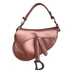 Dior Saddle Mini Silk 2019 Pink with crystals These are professional photos of the actual bag. 2019 Dior Saddle bag, crafted in pink silk satin, the legendary design comes in size mini, features a magnetic flap, and bedazzling crystal embellished CD signature on both sides of the strap. The Saddle bag may be carried by hand. The silk saddle design is extremely classy and elegant Seen on model Bella Hadid. CONDITION: EXCELLENT This preloved item is in excellent condition with minor signs of use. Dior Pink Saddle Bag, Sattle Bag Dior, Dior Rhinestone Saddle Bag, Dior Saddle Bag Limited Edition, Dior Saddle Bag Unique, Saddle Design, Chanel Chevron, Hermes Kelly 25, Bags 2014