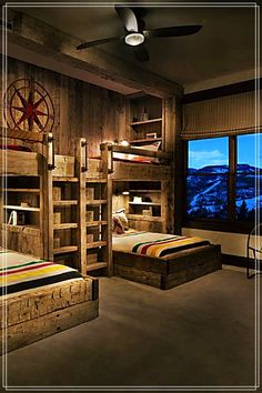 a bedroom with bunk beds and wooden walls