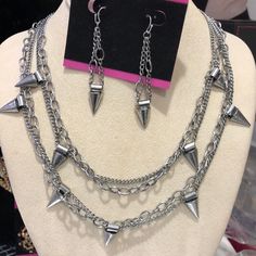 Let Your Rocker Moto Glam Side Shine With Some Tough Chick Chic Accessorizing!! Antiqued Metal Chains And Spikes Will Instantly Update A T-Shirt And Your Favorite Jeans. Free Gift Is Earrings 19” Chain 1” Adjustable Length Lobster Claw Closure Antique Silver Finish 44n -Box 7 Punk Dangle Jewelry With Adjustable Chain, Punk Style Dangle Chain Jewelry, Edgy Silver Chain Jewelry For Party, Edgy Nickel-free Jewelry For Parties, Edgy Dangle Chain Jewelry, Punk Style Silver Chain For Parties, Edgy Dangle Jewelry With Adjustable Chain, Dopamine Jewelry, Rockstar Jewelry