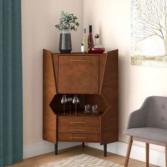 a living room with two chairs and a cabinet