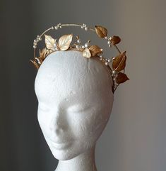 Bridal leaf crown, Elf tiara, Flower and leaf crown, Available with white and cream/ivory pearls (see in menu) ~MATERIALS~ -Austrian crystals (color White clear) -Austrian white pearl beads -Gold tone matt leaves ~SIZE~ Height 2 inch (5 cm) ~SHIPPING AND DELIVERY TIME~ This headpiece is ready to ship by 3-5 days The approximate time of shipment: - 10-16 days to Europe - 15-35 days to United States and other countries. ~IMPORTANT INFORMATION~ -Please allow as much time for shipping as possible be Elf Tiara, Elf Crown, Tiara Flower, Gold Leaf Crown, Tiara Gold, Pearl Crown, Leaf Crown, Crown Gold, Tiara Bridal