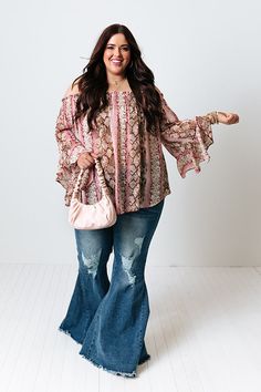 Plus Size - We have no doubt you will fall madly in love with this striking shift top featuring lightweight breezy material patterned with a sangria hued snake print, a straight smocked off-shoulder neckline, long sleeves with oversized flare cuffs, and a draped silhouette that falls into a straight hemline! Measurements XL : Bust 48", Hip 56", Length 23", Sleeve Length 14", Waist 52". 1XL : Bust 50", Hip 58", Length 24", Sleeve Length 14.5", Waist 54". 2XL : Bust 52", Hip 60", Length 25", Sleeve Length 15", Waist 56". Boho Western Outfits Plus Size, Plus Size Hippie Outfits, Southwestern Outfits, Boho Western Outfits, Women's Plus Size Jeans, Boho Plus Size, Plus Size Fashionista, Plus Size Boutique, Winter Boho