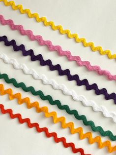 multicolored ribbon on white background with scissors