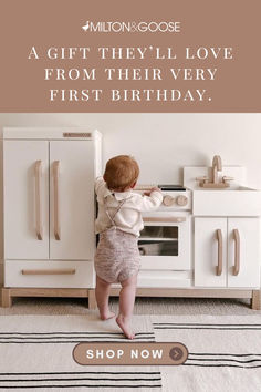 A baby plays at her new Milton & Goose Essential play kitchen and refrigerator. Text on the image says "Milton & Goose: A gift they'll love from their very first birthday. Shop now." Play Kitchen Fridge, Play Refrigerator, Childrens Play Kitchen, Best Toddler Gifts, Kitchen Fridge, Wooden Play Kitchen, Toddler Christmas Gifts, Kitchen Fridges, Play Kitchen Sets