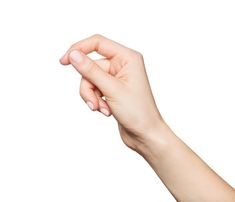 a person's hand holding something in the air with their left thumb on it