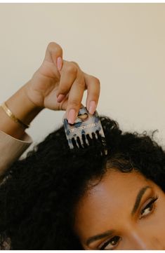 What it is: A compact wide-toothed comb for detangling, fluffing up your hair and so much more.Who it's for: Ideal for thick, wavy, curly and coiled hair types.What it does: The comb is designed to dig down to the scalp, allowing the hair roots to be stretched straight into a desired style or shape using a picking motion. Not only will this detangle textured hair with minimal tension and damage on the hair strand, it also helps lift from the root, creating big, voluminous hair. The comb was insp Hair Tools Aesthetic, Curly Hair Salon, Hair Inspired, 3c Hair, Scrub Corpo, Hair Gloss, Hair Roots, Hair Coils, Wooden Comb