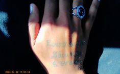 a person's hand with a ring on it that says, everyone is going to save the earth