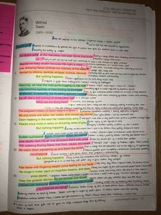 an open book with many different colored lines on the page and writing underneath it in black ink