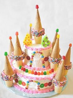 a cake decorated with ice cream cones and sprinkles