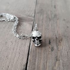 Embrace your bold style with this meticulously crafted sterling silver skull pendant, designed exclusively for both men and women who appreciate fine details and daring accessories. The intricate design features a finely polished finish, giving the skull a menacing yet sophisticated look. Perfect for adding a touch of rock-and-roll flair or a statement piece to your everyday attire, this pendant exudes confidence and strength. ✦ DETAILS ✦ ---------------------- M A T E R I A L : sterling silver 925 (skull and chains) F I N I S H : polished D I M E N S I O N :skull measures 18x8mm, chain is 18inches (app. 45cm) W E I G H T : skull is 5.5gr I M P O R T A N T All chains have an extension of 1 inch (2,5cm) at the end so that you can adjust the total length of the chain. You can buy ONLY the sk Anatomical Skull, Memento Mori Jewelry, Necklace Gothic, Skull Necklace, Skull Pendant, Jewelry For Men, Gothic Jewelry, Memento Mori, G H