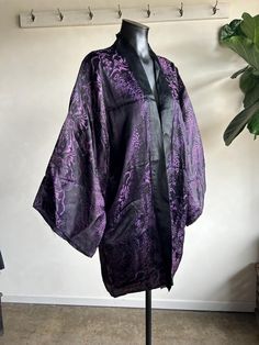 Beautiful Vintage 1930s Purple and BLack Jaquard Weave Silk Kimono Robe. Purple and black in color made from all silk fibers. Gorgeous detailed kimono/Japanese stitching throughout. Robe is super soft and lightweight with a relaxed fit. Condition overall is great with only minor flaws that include; there a few tiny pinholes on front. No rips, tears, or staining. Please see all photos for details. Refer to measurements below to ensure a proper fit (modeled on a size medium mannequin)  24"-26" pit to pit 15" shoulder to shoulder 36" in length (top of shoulder to bottom hem) Outfit With Kimono, Black And Pink Kimono, Dark Kimono, Japanese Stitching, Luxury Purple Kimono For Women, Purple Haori, Purple Kimono, Luxury Purple Silk Kimono, Purple Goth