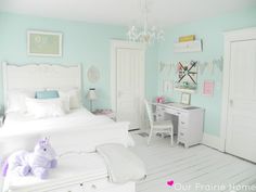 a bedroom with mint green toddler room and white bedding in the corner, on instagram from pinterest com