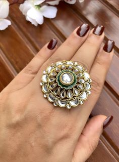 Shine like a glowing star in this exquisitely designed clear stone kundan ring with green meenakari work. Pair it up with your silks and satins to add charm and charisma to your beautiful personality.   Ring is adjustable so can fit any size comfortably Item is ready to be shipped from New Delhi, India Gold Kundan Toe Ring, Festive Kundan Meenakari Rings, Kundan Rings As Festive Gifts, Green Enamel Round Ring For Weddings, Kundan Toe Rings For Festivals, Festive Kundan Rings With Stone Work, Kundan Meenakari Toe Ring, Meenakari Kundan Toe Ring, Gold Jewelry With Dori Work For Wedding