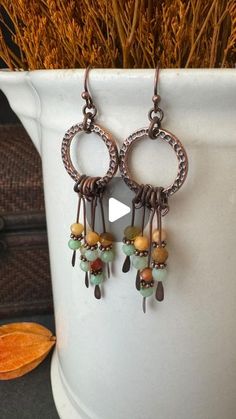 Andria Bieber on Instagram: "💚Make some earrings with me and @limabeads 💚
You will need:
copper jump rings 6 mm 
Cooper ear wire 
Hammered copper rings
4mm copper daisy spacer bead 
Copper paddle pins 
Burma Jade Ombré Faceted Round 4mm SKU: 71237
Beading tools. 
Directions:
You will need 10 paddle pins, 5 for each earring.
add 1 Jade stone, 1 daisy spacer bead, 1 jade stone to 1 paddle pin. Wire wrap  loop at the top. 
now I stagger the length of my paddle pins from the longest in the center to shortest on the outside. 
attach each paddle pin to hammered ring with 6 mm jump ring. 
Attach one 6 mm jump ring to the top of the hammered ring, add 1- 3mm jump ring to the 6mm and attach copper ear wire. 
You’ve made a pair of earrings 😃
check out limabeads.com for amazing jewelry supplies
💚 Hammered Ring, Beading Tools, Copper Rings, Hammered Copper, Jade Stone, Wire Wrap, Ear Wire, Jump Rings