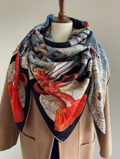 Gorgeous Imagination Coat of Armor Pattern Large Square Scarf /Shawl /Wrap Material: 70% wool 30% silk Size: 140 cm x 140 cm / 55 in x 55 in As this shawl is hand-rolled, the dimensions indicated may vary. Edges: Hand-Rolled Edges An imaginative coat of armor in hues of blue, green, and deep orange for warm and loving protection. Can style as a neck scarf, a head scarf, a shawl, or a wrap. Suitable for all seasons, gift ideas for the holiday season and special occasions Care Instructions: Please Luxury Traditional Silk Scarf For Gift, Armor Pattern, Luxury Scarf, Silk Scarf Style, Scarf Square, Luxury Scarves, Square Silk Scarf, Deep Orange, Designer Scarves