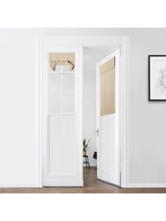 an open door in a white room