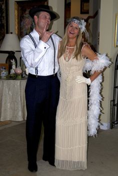 a man and woman dressed up for a party