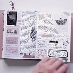 an open book with lots of papers and stickers on the pages that are attached to it