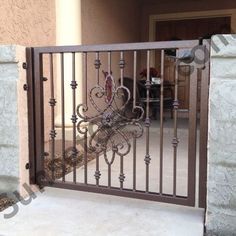 an iron gate in front of a house