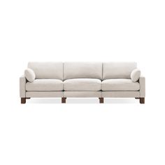 a white couch sitting on top of a wooden frame