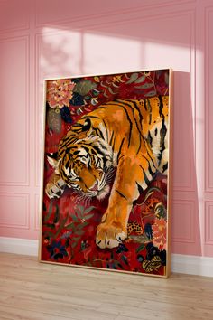 a large tiger painting on a pink wall in a room with wooden floors and walls