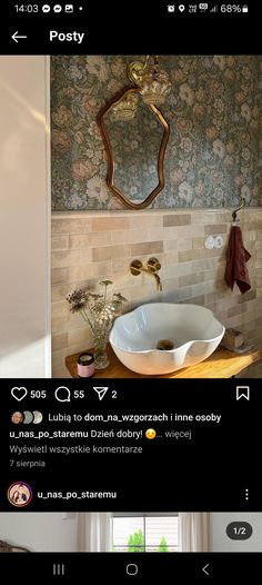 an image of a bathroom with flowers on the wall and in the background is a mirror