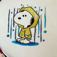 a drawing of a cartoon dog with rain drops on it's face and ears