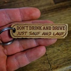 a wooden keychain that says, don't drink and drive just saut and laugh