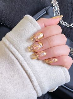 LUXURY GOLD FLAKE GLOSSY NAILS; Model nail shape= LONG COFFIN INCLUDES; - 10 custom Handmade nails - Cuticle pusher - Gel Tabs (optional) - Nail Glue (optional) Nails are reusable and can be worn many times! Last up to 2 weeks with proper care and kept clean. PLEASE NOTE: *We are not responsible for any incorrect sized nails or damage caused to nails upon wear* Every set is handmade, so any slight variations in colour/ design may be expected If you have any questions or concerns don't hesitate to get in touch! HOW TO APPLY: 1. Push cuticles back 2. Wipe nail with alcohol wipe/ acetone 3. Apply gel tabs/ Nail glue 4. Press nails on firmly 5. All done!! HOW TO REMOVE: 1. Gently peel off gel tabs OR 2. Soak nails to soften nail glue and peel off NAIL SHAPES AND LENTHS: Extra Long Ballerina: S Fall Nails Gold Flakes, Brown Nails With Gold, Nails Gold Flakes, Nails With Gold Flakes, Nails With Gold, Uk Nails, Natural Nail Art, Chrome Nail Art, Luxury Press On Nails