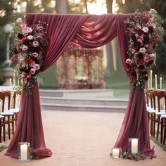 an outdoor ceremony set up with candles and flowers