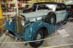 an antique car on display in a museum