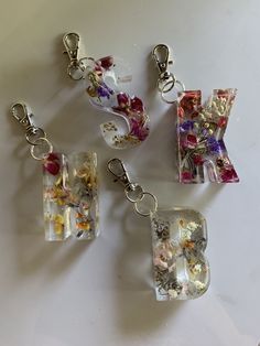 four pieces of glass with flowers on them