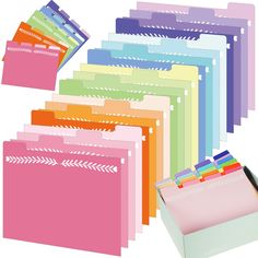 a bunch of folders that are stacked on top of each other with different colors