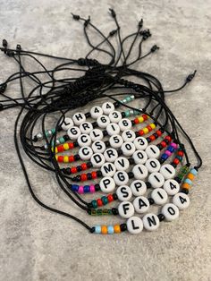 a string with beads and letters on it