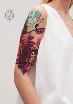 a woman with a tattoo on her arm