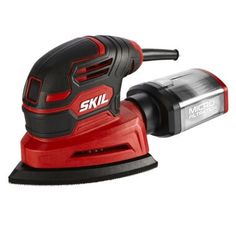 a red and black sander on a white background with the words skil in it