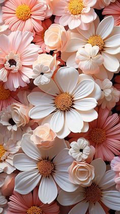 a bunch of flowers that are in the middle of some kind of flower arrangement with pink, white and orange petals