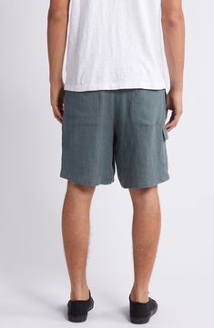 Weekend styling is a breeze in these relaxation-ready linen shorts that have plenty of pockets for on-the-go storage. 9" inseam; 25 1/2" leg opening; 12 1/4" front rise Elastic/drawstring waist Side-seam pockets; cargo flap-patch pocket 100% linen Hand wash, line dry Imported Relaxed Short Bottoms With Pockets, Casual Linen Bermuda Shorts With Relaxed Fit, Casual Linen Bottoms With Side Pockets, Casual Linen Shorts With Side Pockets, Relaxed Short Bottoms With Side Pockets, Relaxed Short Length Bottoms With Side Pockets, Vacation Linen Bottoms With Side Pockets, Summer Beach Bottoms With Hip Pockets, Casual Linen Bermuda Shorts For Beach