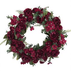 a wreath with red flowers and green leaves