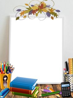 an empty paper surrounded by school supplies on a wooden table