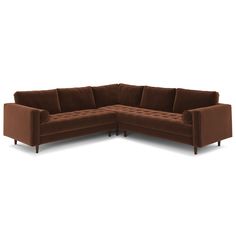 a brown sectional couch sitting on top of a white floor