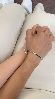 a person wearing a bracelet on their arm