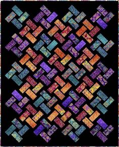 a quilt made with colorful squares in black and orange colors, on a black background