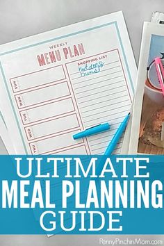 the ultimate meal planning guide is on top of a table next to a cup of coffee