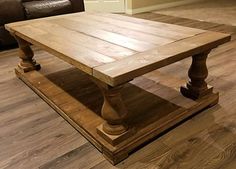 a wooden table sitting on top of a hard wood floor